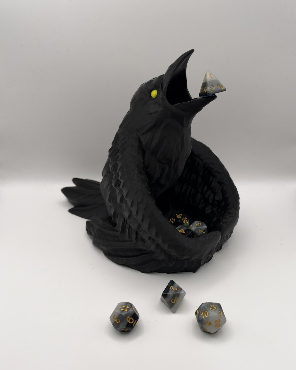 Black Raven Dice Tower with open beak and dice in its wings